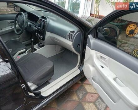 Черный Киа Черато, объемом двигателя 1.6 л и пробегом 260 тыс. км за 3800 $, фото 2 на Automoto.ua