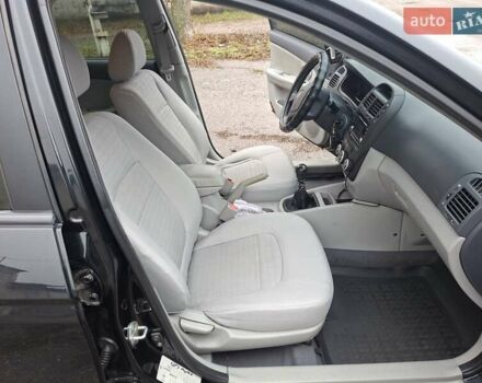 Черный Киа Черато, объемом двигателя 1.6 л и пробегом 225 тыс. км за 5200 $, фото 11 на Automoto.ua