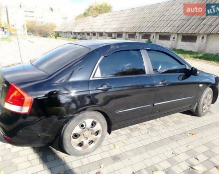 Чорний Кіа Черато, об'ємом двигуна 1.6 л та пробігом 335 тис. км за 5500 $, фото 7 на Automoto.ua