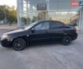 Чорний Кіа Черато, об'ємом двигуна 1.6 л та пробігом 299 тис. км за 4500 $, фото 1 на Automoto.ua