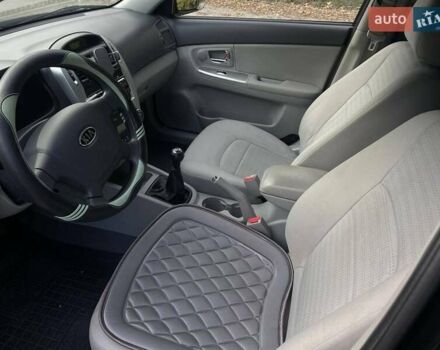 Черный Киа Черато, объемом двигателя 2 л и пробегом 173 тыс. км за 4800 $, фото 12 на Automoto.ua