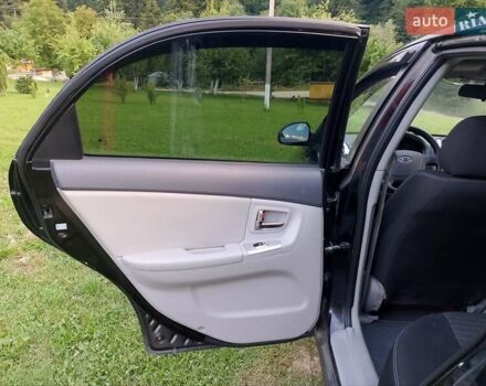 Черный Киа Черато, объемом двигателя 1.59 л и пробегом 237 тыс. км за 3900 $, фото 14 на Automoto.ua