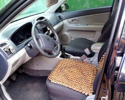 Черный Киа Черато, объемом двигателя 1.6 л и пробегом 297 тыс. км за 3500 $, фото 7 на Automoto.ua