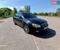 Черный Киа Черато, объемом двигателя 1.6 л и пробегом 225 тыс. км за 5200 $, фото 1 на Automoto.ua