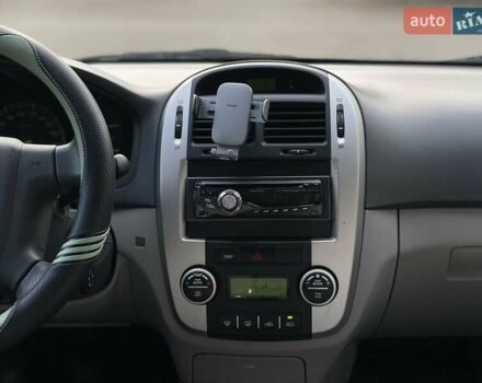 Черный Киа Черато, объемом двигателя 2 л и пробегом 173 тыс. км за 4800 $, фото 17 на Automoto.ua