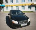 Черный Киа Черато, объемом двигателя 1.59 л и пробегом 318 тыс. км за 3500 $, фото 1 на Automoto.ua
