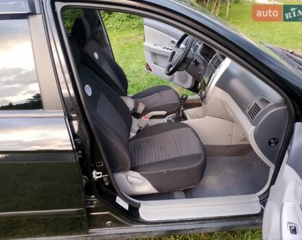 Черный Киа Черато, объемом двигателя 1.59 л и пробегом 237 тыс. км за 3900 $, фото 17 на Automoto.ua