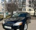 Черный Киа Черато, объемом двигателя 1.98 л и пробегом 292 тыс. км за 5000 $, фото 1 на Automoto.ua