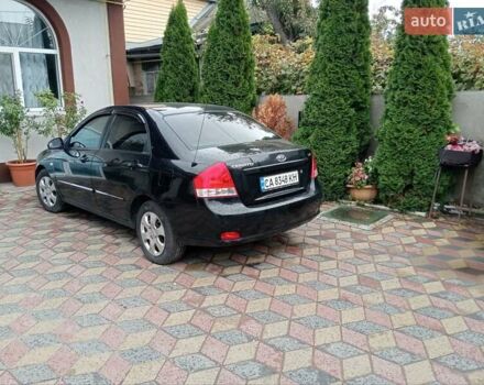 Черный Киа Черато, объемом двигателя 1.6 л и пробегом 260 тыс. км за 3800 $, фото 5 на Automoto.ua