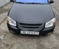 Черный Киа Черато, объемом двигателя 1.98 л и пробегом 259 тыс. км за 4100 $, фото 1 на Automoto.ua