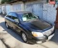 Черный Киа Черато, объемом двигателя 1.98 л и пробегом 181 тыс. км за 6000 $, фото 1 на Automoto.ua
