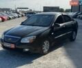 Черный Киа Черато, объемом двигателя 1.6 л и пробегом 261 тыс. км за 4990 $, фото 1 на Automoto.ua