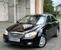 Чорний Кіа Черато, об'ємом двигуна 1.6 л та пробігом 198 тис. км за 4400 $, фото 1 на Automoto.ua