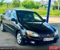 Черный Киа Черато, объемом двигателя 1.6 л и пробегом 259 тыс. км за 4850 $, фото 1 на Automoto.ua