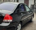 Черный Киа Черато, объемом двигателя 1.6 л и пробегом 185 тыс. км за 4700 $, фото 1 на Automoto.ua
