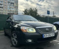 Черный Киа Черато, объемом двигателя 1.58 л и пробегом 350 тыс. км за 4500 $, фото 1 на Automoto.ua