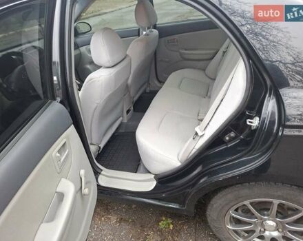 Черный Киа Черато, объемом двигателя 1.6 л и пробегом 225 тыс. км за 5200 $, фото 12 на Automoto.ua