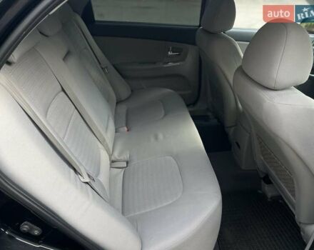 Черный Киа Черато, объемом двигателя 2 л и пробегом 173 тыс. км за 4800 $, фото 20 на Automoto.ua