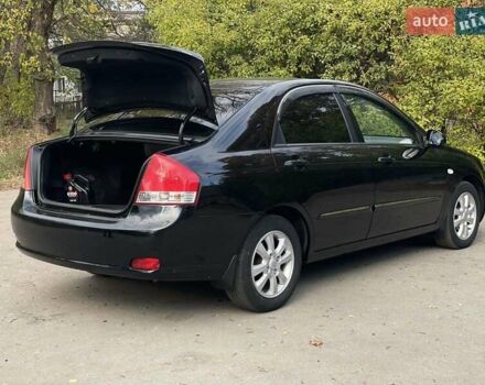 Черный Киа Черато, объемом двигателя 2 л и пробегом 173 тыс. км за 4800 $, фото 10 на Automoto.ua
