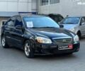 Черный Киа Черато, объемом двигателя 1.6 л и пробегом 239 тыс. км за 5990 $, фото 2 на Automoto.ua