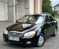 Черный Киа Черато, объемом двигателя 1.6 л и пробегом 198 тыс. км за 3999 $, фото 1 на Automoto.ua