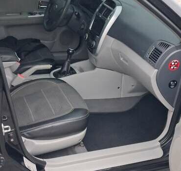 Кіа Черато 2008 у Кременчуге на Automoto.ua Чорний Кіа Черато, об'ємом двигуна 2 л та пробігом 193 тис. км за 5300 $, фото 12 на Automoto.ua