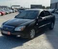 Чорний Кіа Черато, об'ємом двигуна 1.6 л та пробігом 261 тис. км за 4954 $, фото 1 на Automoto.ua