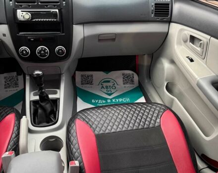 Черный Киа Черато, объемом двигателя 1.6 л и пробегом 258 тыс. км за 5200 $, фото 14 на Automoto.ua