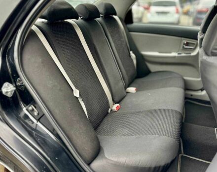 Чорний Кіа Черато, об'ємом двигуна 2 л та пробігом 270 тис. км за 4000 $, фото 12 на Automoto.ua