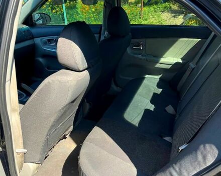 Черный Киа Черато, объемом двигателя 1.6 л и пробегом 300 тыс. км за 3000 $, фото 3 на Automoto.ua