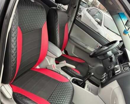 Черный Киа Черато, объемом двигателя 1.6 л и пробегом 258 тыс. км за 5200 $, фото 6 на Automoto.ua