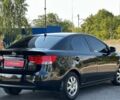 Чорний Кіа Черато, об'ємом двигуна 2 л та пробігом 170 тис. км за 5700 $, фото 1 на Automoto.ua