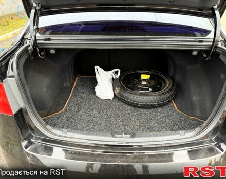 Черный Киа Черато, объемом двигателя 1.6 л и пробегом 200 тыс. км за 5650 $, фото 9 на Automoto.ua