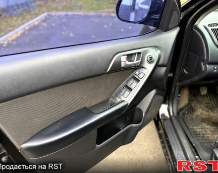 Черный Киа Черато, объемом двигателя 1.6 л и пробегом 200 тыс. км за 5650 $, фото 7 на Automoto.ua