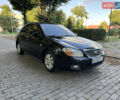 Чорний Кіа Черато, об'ємом двигуна 1.98 л та пробігом 265 тис. км за 5900 $, фото 1 на Automoto.ua