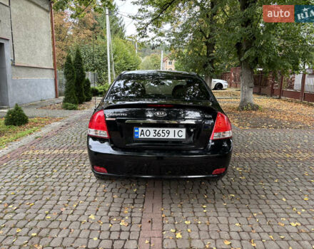 Черный Киа Черато, объемом двигателя 1.98 л и пробегом 264 тыс. км за 5800 $, фото 4 на Automoto.ua