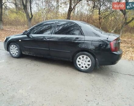 Черный Киа Черато, объемом двигателя 1.6 л и пробегом 280 тыс. км за 2999 $, фото 1 на Automoto.ua