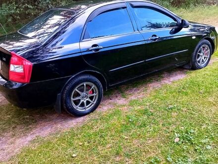 Чорний Кіа Черато, об'ємом двигуна 1.6 л та пробігом 196 тис. км за 4000 $, фото 1 на Automoto.ua