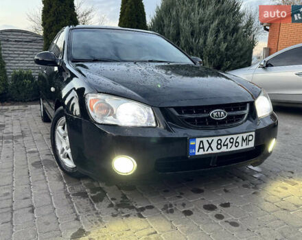 Черный Киа Черато, объемом двигателя 2 л и пробегом 318 тыс. км за 3900 $, фото 1 на Automoto.ua