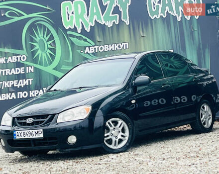 Чорний Кіа Черато, об'ємом двигуна 2 л та пробігом 319 тис. км за 4300 $, фото 1 на Automoto.ua