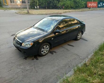 Чорний Кіа Черато, об'ємом двигуна 1.5 л та пробігом 221 тис. км за 4200 $, фото 1 на Automoto.ua