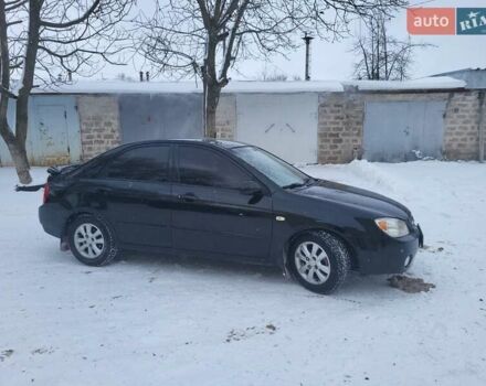 Черный Киа Черато, объемом двигателя 1.6 л и пробегом 328 тыс. км за 3800 $, фото 1 на Automoto.ua