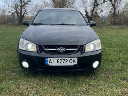 Черный Киа Черато, объемом двигателя 1.98 л и пробегом 315 тыс. км за 5745 $, фото 1 на Automoto.ua
