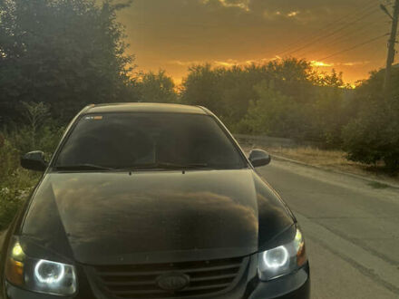 Черный Киа Черато, объемом двигателя 1.59 л и пробегом 314 тыс. км за 5000 $, фото 1 на Automoto.ua