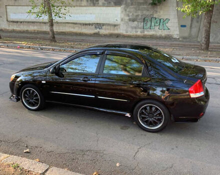 Черный Киа Черато, объемом двигателя 1.6 л и пробегом 140 тыс. км за 5800 $, фото 1 на Automoto.ua