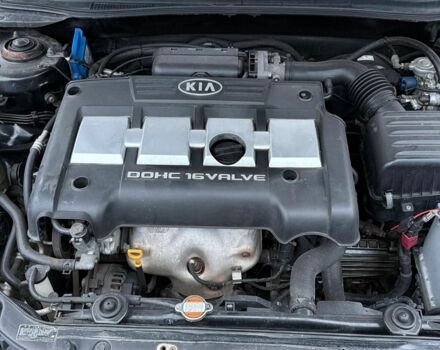 Черный Киа Черато, объемом двигателя 1.6 л и пробегом 220 тыс. км за 3300 $, фото 1 на Automoto.ua