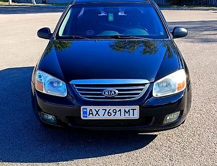 Чорний Кіа Черато, об'ємом двигуна 1.6 л та пробігом 291 тис. км за 3700 $, фото 1 на Automoto.ua