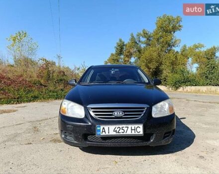 Черный Киа Черато, объемом двигателя 1.6 л и пробегом 322 тыс. км за 3000 $, фото 1 на Automoto.ua