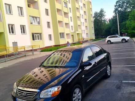 Черный Киа Черато, объемом двигателя 1.6 л и пробегом 200 тыс. км за 3999 $, фото 1 на Automoto.ua