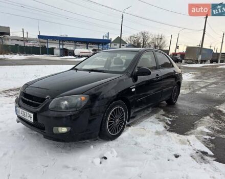 Черный Киа Черато, объемом двигателя 1.59 л и пробегом 270 тыс. км за 3700 $, фото 1 на Automoto.ua